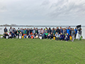  Volunteers pose in front of the water on the Niagara Shoreline trail